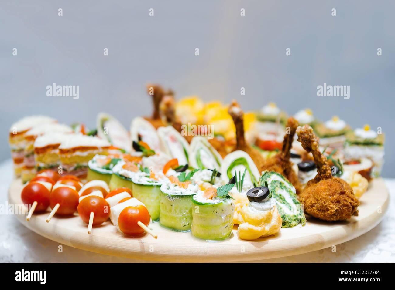 Colorful starter meal selection on a wooden plate Stock Photo Alamy