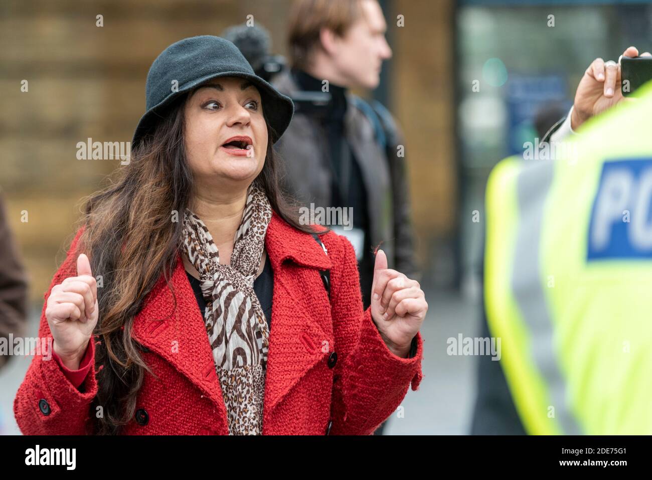 Well dressed white Caucasian female arguing with police at a COVID 19 Coronavirus anti lockdown protest march in London, UK Stock Photo
