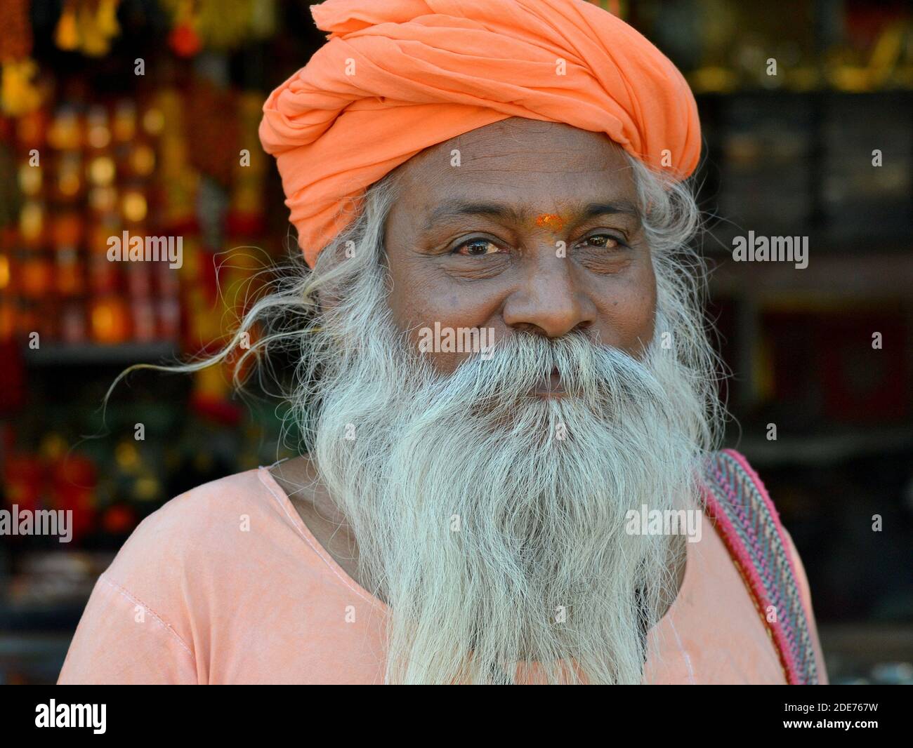 Old Indian Hindu holy man (sadhu, baba, guru) with thick white full
