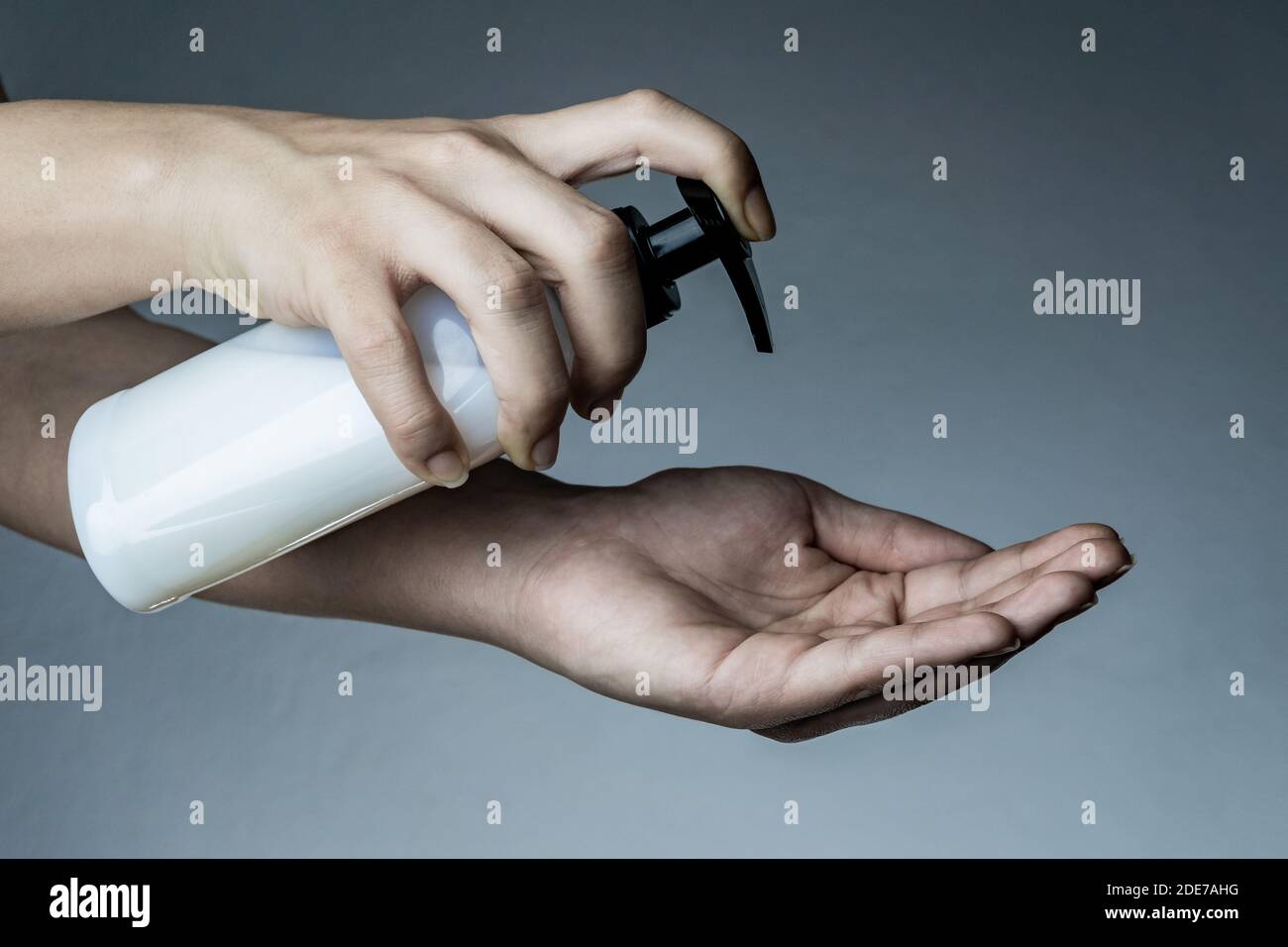 Woman's hand that applying disinfectant to cleaning. Sanitizer for Coronavirus, Covid-19, SARS-CoV-2 outbreak. 2019 Novel Coronavirus concept. Stock Photo