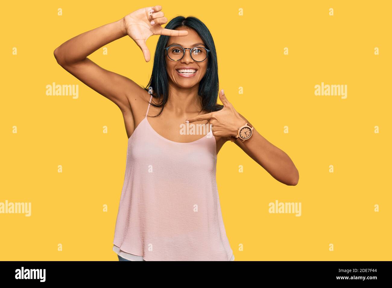 Young african american woman wearing casual clothes and glasses smiling ...