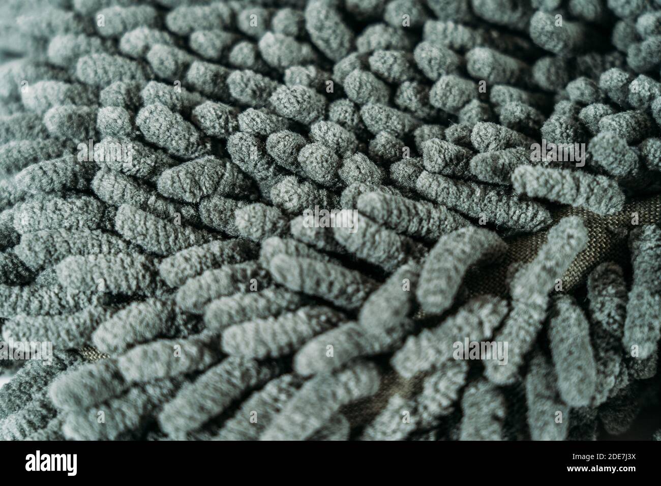 Gray fibers of microfiber fabric - fabric made from polyester fibers, may consist of polyamide and other polymers. Stock Photo