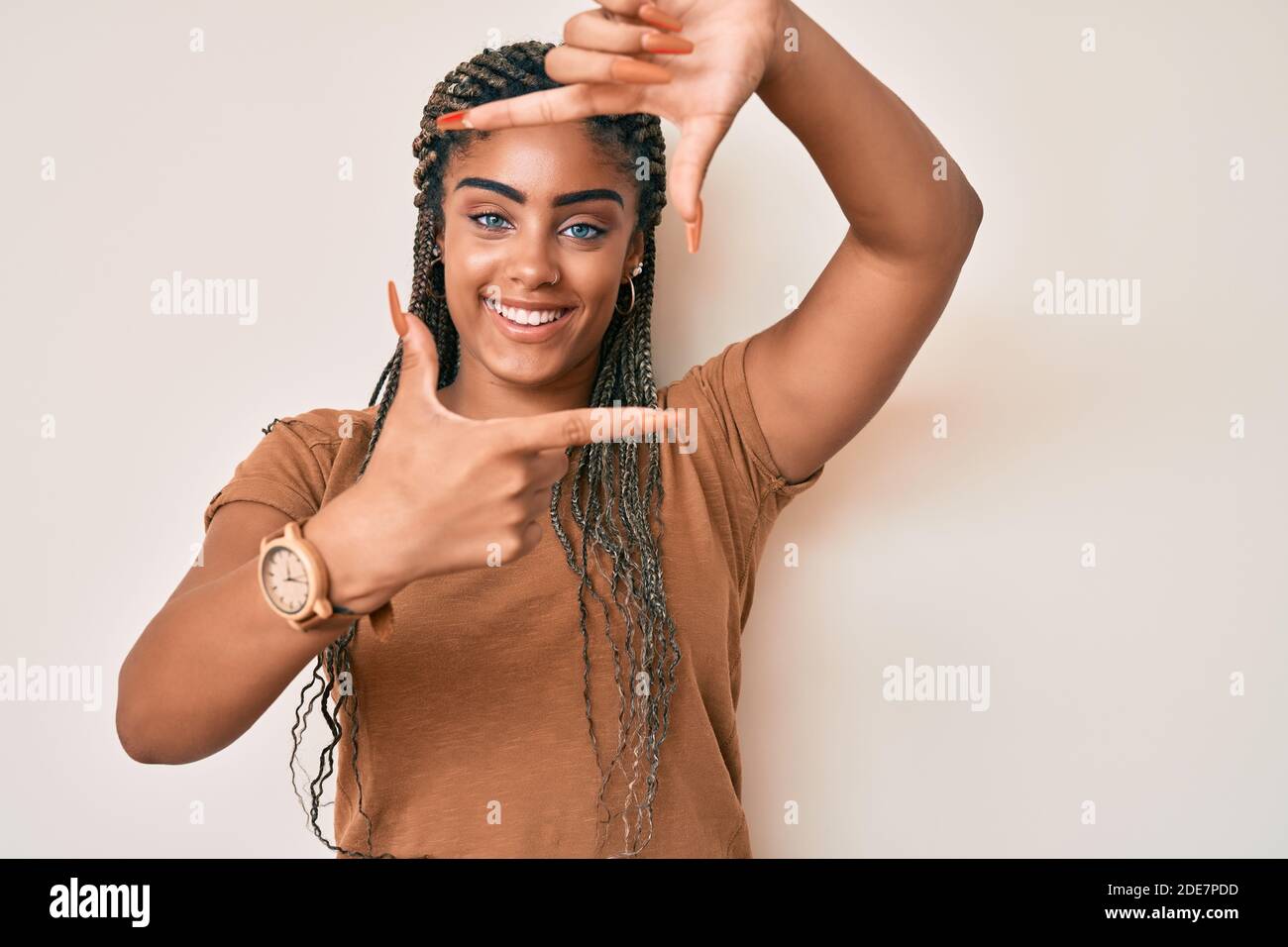 Young african american woman with braids wearing casual clothes smiling ...