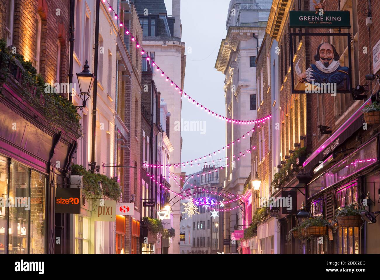 Carnaby Street Christmas Lights 2020 Bright Neon Pink Shakespeares Head Pub, Foubert's place, Soho, West End, Westminster, London W1F Stock Photo