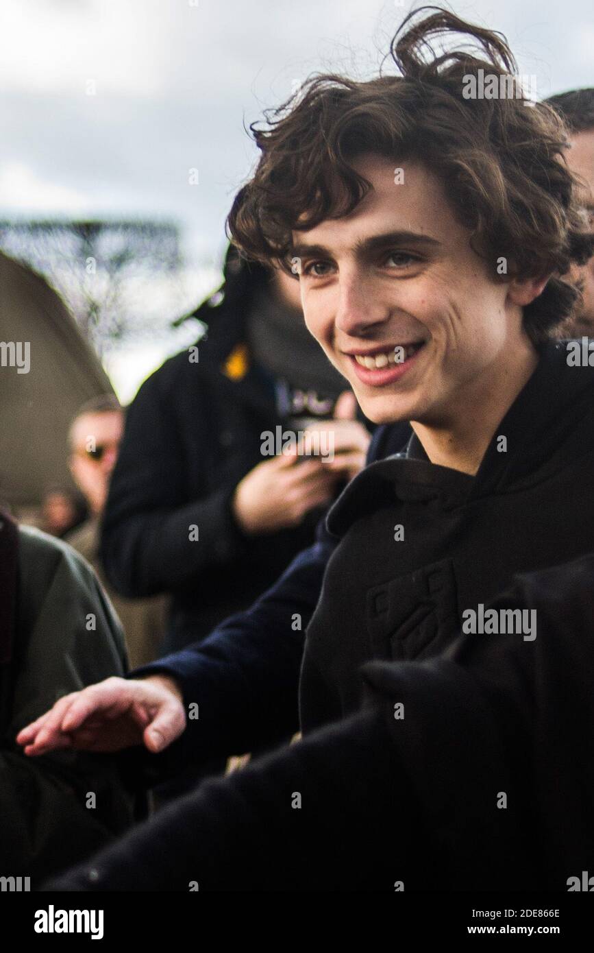 Timothee Chalamet smiles before the Louis Vuitton shows as part of