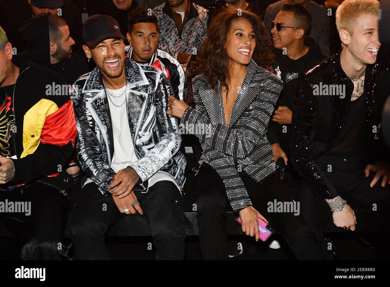 Neymar, Cindy Bruna and Machine Gun Kelly attend the Christian Balmain