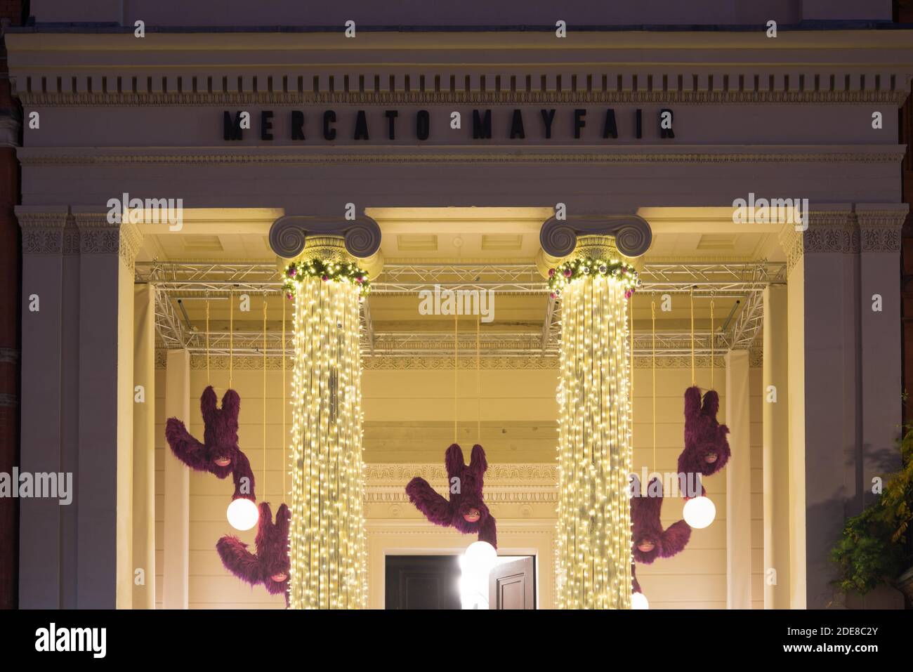 Greek Revival Architecture Ionic Columns Yellow Christmas Lights Mercato Metropolitano Mayfair, North Audley Street, West End, Mayfair, London W1K Stock Photo
