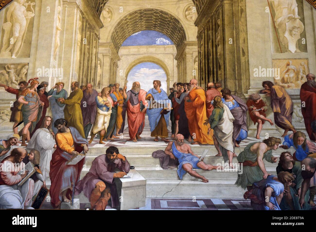 The School of Athens by Raphael(Raffaello Sanzio 1483-1520) Painted between 1509 and 1511 as a part of Raphael's commission to decorate the rooms now known as the Stanze di Raffaello, in the Apostolic Palace in the Vatican. Center : Plato,Aristotle. Sitting: L to R : Pythagoras,Heraclitus,Diogenes of Sinope Raphael Rooms,Room of the Signature. Vatican, 2018. - The Vatican Museums contain masterpieces of painting, sculpture and other works of art collected by the popes through the centuries. Through their diversity and richness, the Vatican museums rank among the first great museums in the worl Stock Photo