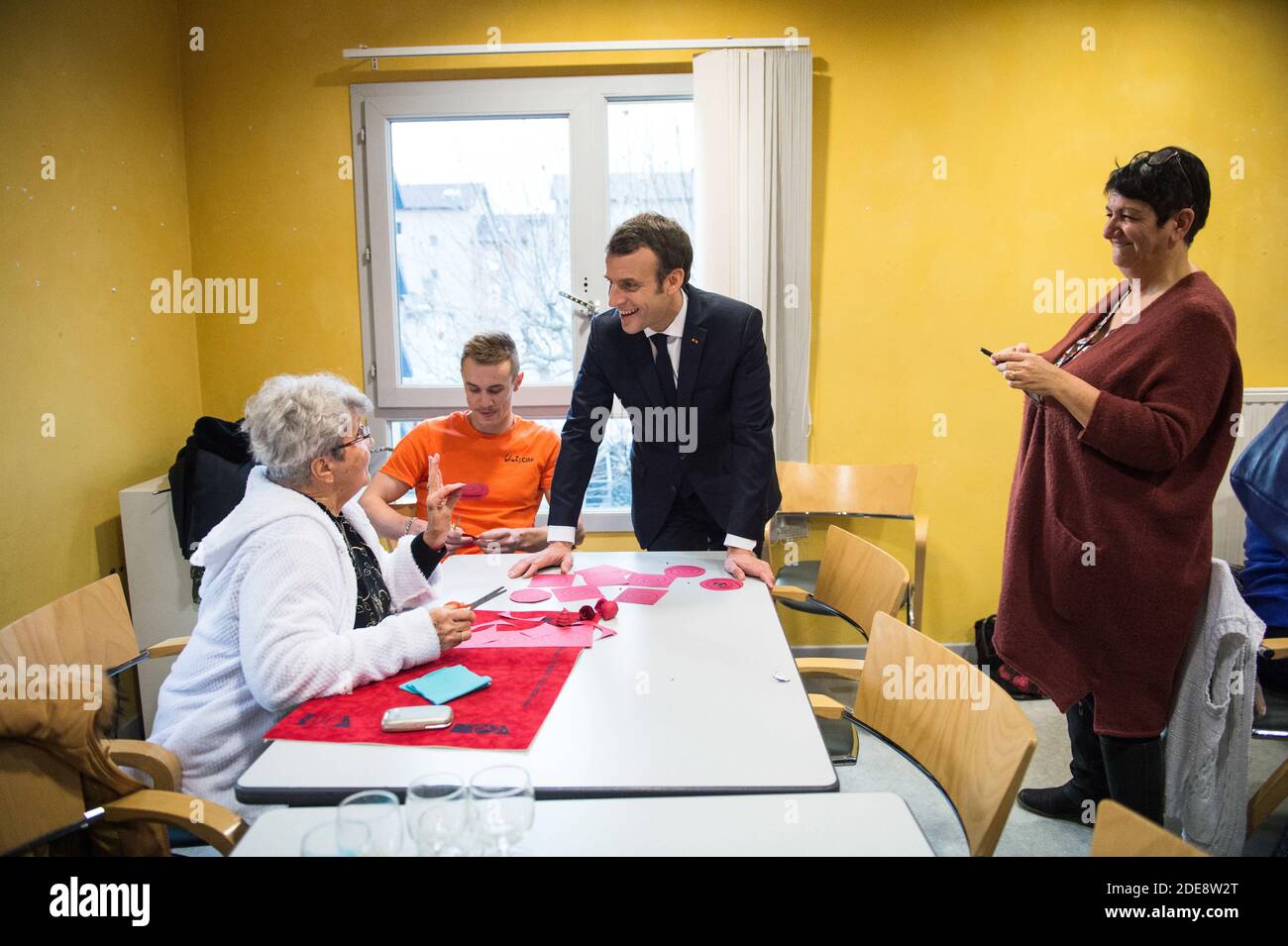 French President Emmanuel Macron meets elderly people in a retirement home  (EPHAD) at the day center Le Clos de l'Hermitage in Bourg-de-Peage near  Valence, southern France, January 24, 2019. Macron visits the