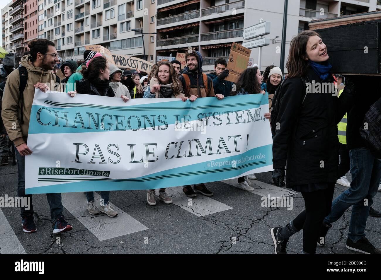 Banner 'Changeons le système, pas le climat' (Let's change the system, not climate). The march for the climate and against global warming, organized in more than 90 cities in France by the collective 'Citizens for the Climate', resulted in a demonstration in Toulouse. And despite the wind, the cold and rain showers, dozens of the protestors took up the challenge of posing in swimsuits. Photo by Patrick Batard / ABACAPRESS.COM Stock Photo