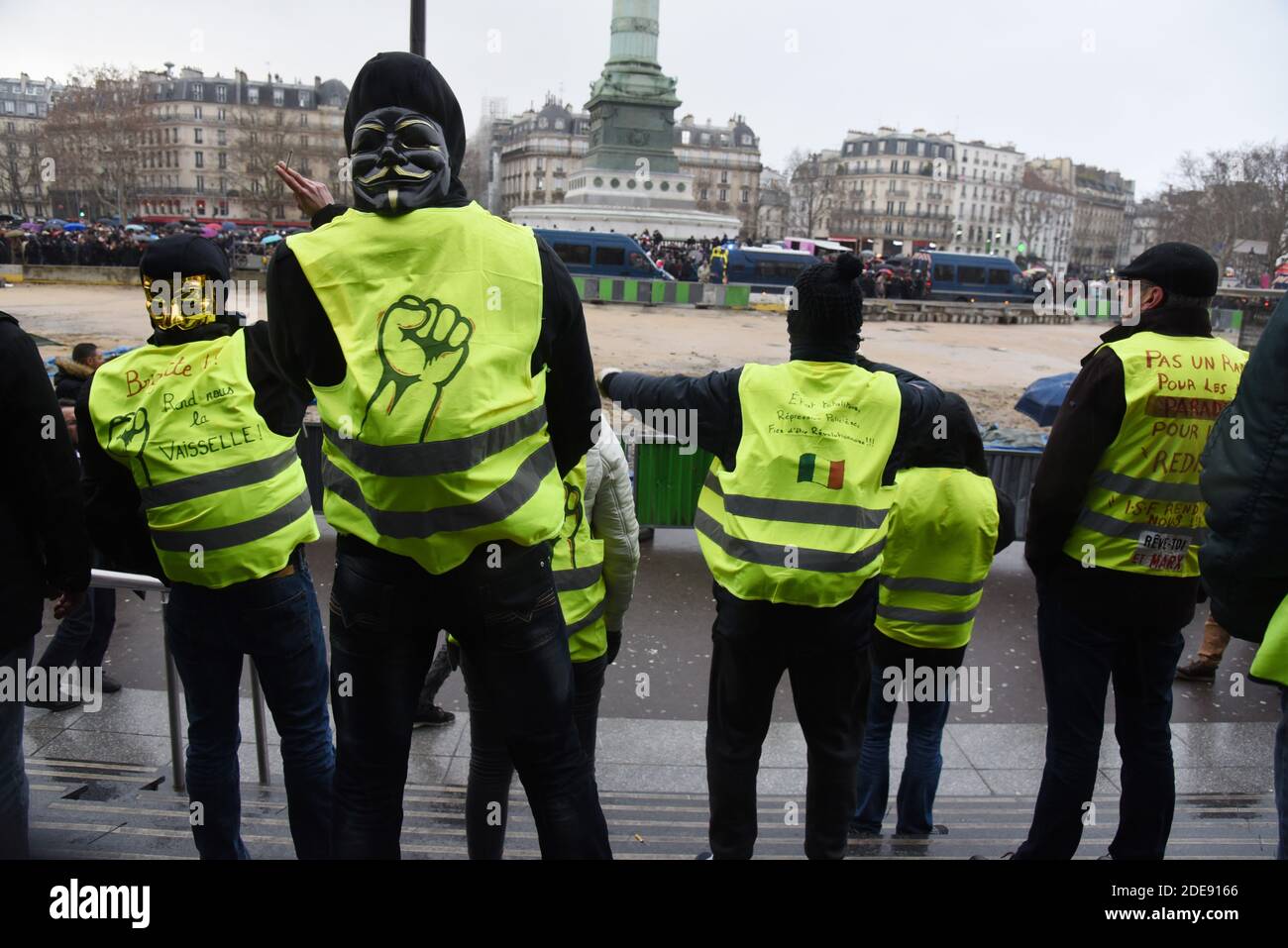 People wearing Yellow Vests (Gilets Jaunes) gesture as more than 10.000 Red  Scarves (Foulards Rouges) demonstrators walk the Place de la Bastille to  protest against Yellow Vests (Gilets Jaunes) violence during the