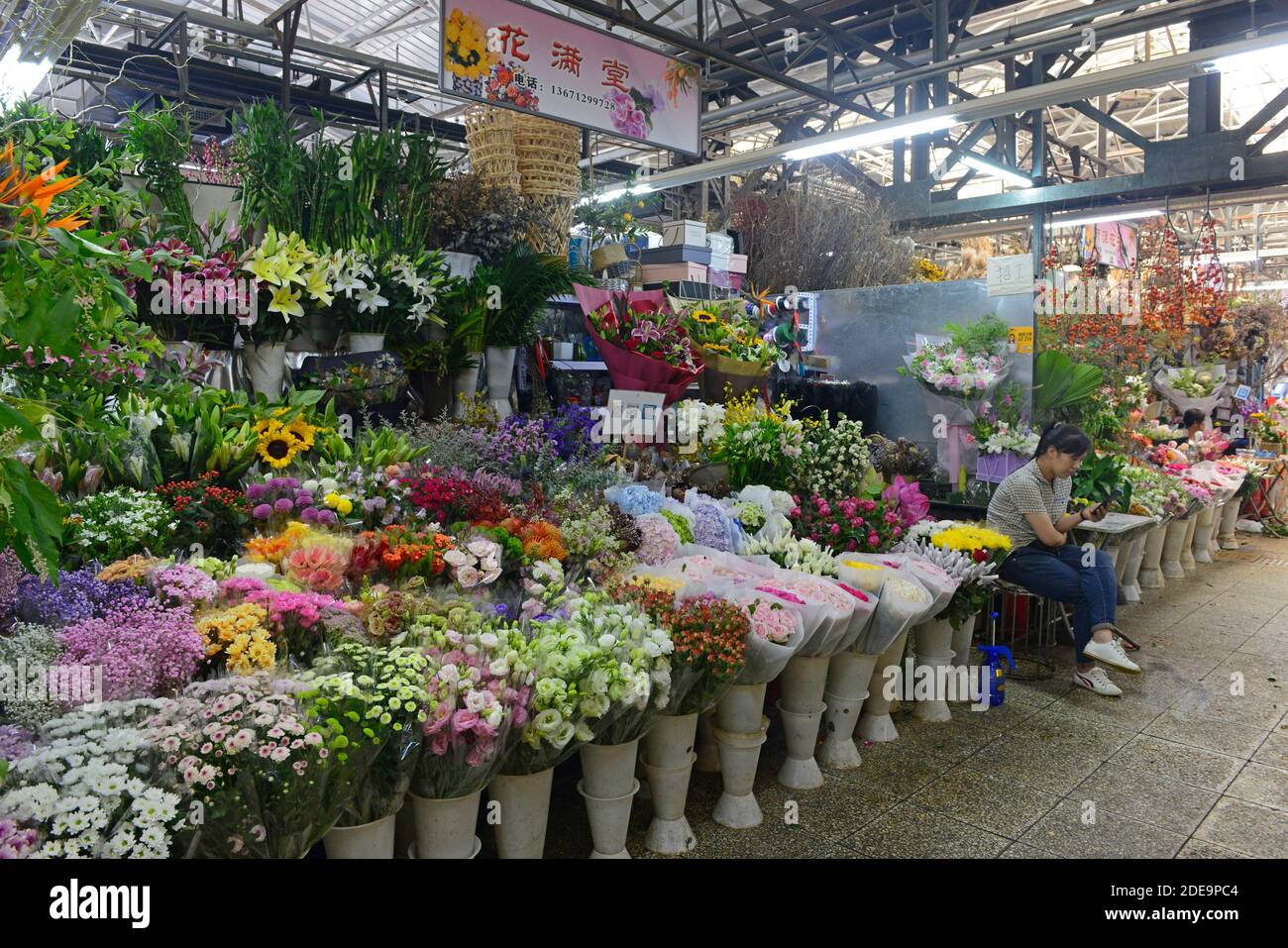 Many bunches of cut flowers for sale at a flower and plant market in