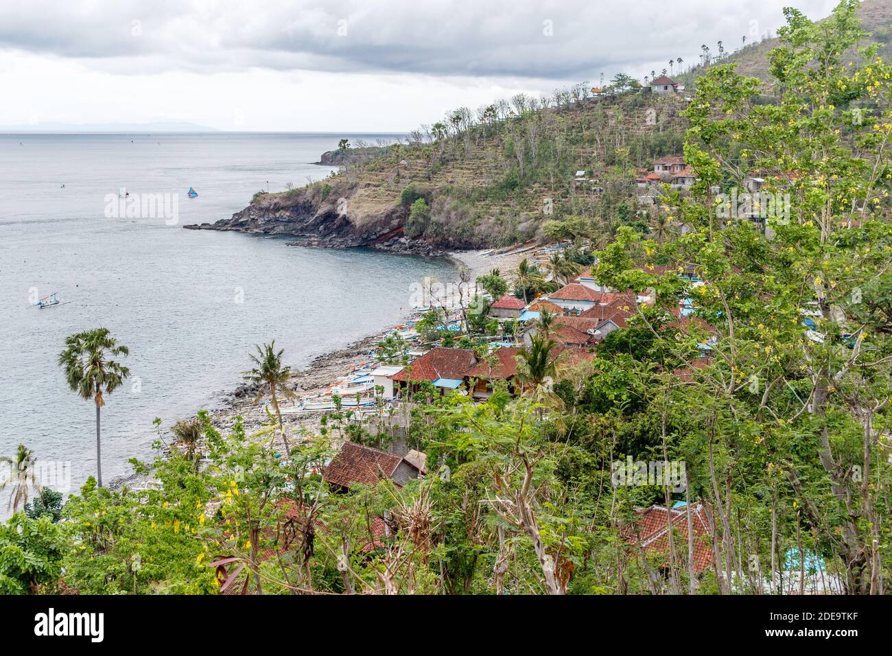 Views of Amed ocean, bay, houses, traditional fishing boats jukung