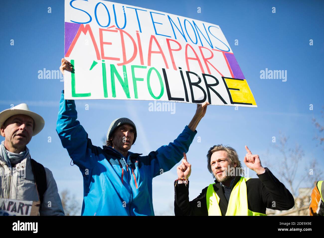 Jean baptiste redde alias Voltuan hold a sign "Support Mediapart, free  information". ( Soutenons mediapart l'info libre) People take part in a  demonstration called by the yellow vest (gilets jaunes) movement on