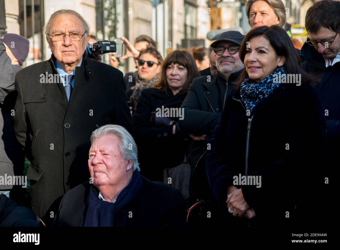Jean-Jacques Sempe (seated) attends the unveiling of a wall fresco from one of his artwork by Mayor of Paris Anne Hidalgo (R), at the crossing of Boulevard des Filles du Calvaire and Rue Froissard, 3rd District of Paris, France, Febuary 16, 2019. Photo by Denis PrezatAvenir Pictures/ABACAPRESS.COM Stock Photo