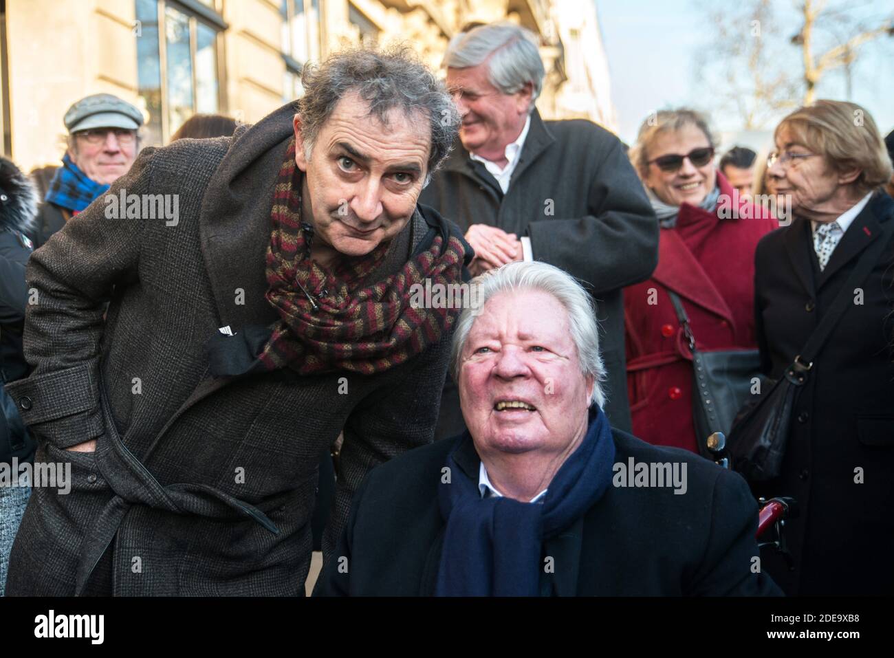 Jean-Jacques Sempe (seated) attends the unveiling of a wall fresco from one of his artwork, along side François Morel, at the crossing of Boulevard des Filles du Calvaire and Rue Froissard, 3rd District of Paris, France, Febuary 16, 2019. Photo by Denis PrezatAvenir Pictures/ABACAPRESS.COM Stock Photo