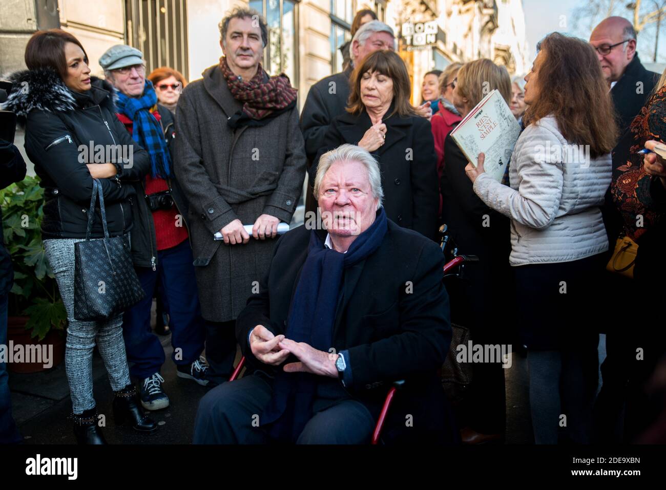 Jean-Jacques Sempe (seated) attends the unveiling of a wall fresco from one of his artwork, along side François Morel, at the crossing of Boulevard des Filles du Calvaire and Rue Froissard, 3rd District of Paris, France, Febuary 16, 2019. Photo by Denis PrezatAvenir Pictures/ABACAPRESS.COM Stock Photo