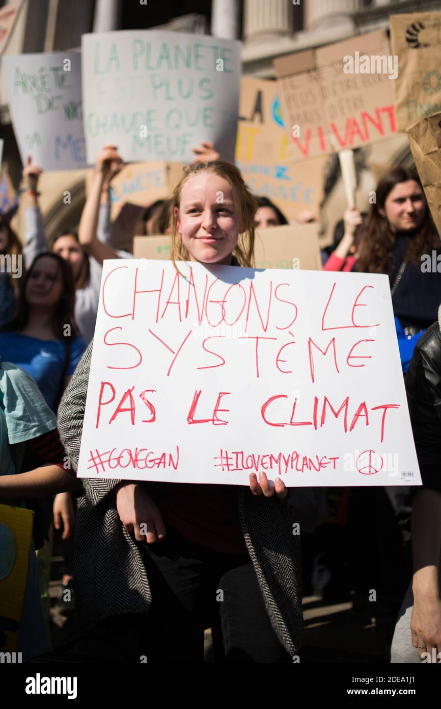 Students shout slogans and holds a sign 'Change the system, not the climate' (Changons le systeme pas le climat) during the march for the environment and the climate organized by students, in Paris on February 22, 2019. Photo by Raphael Lafargue/ABACAPRESS.COM Stock Photo