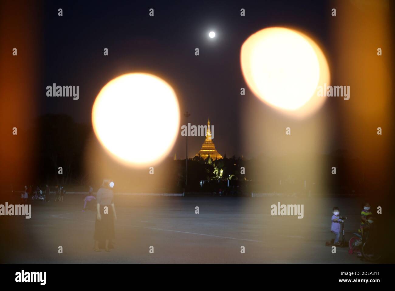 Myanmar, Myanmar. 29th Nov, 2020. A full moon rises above the Shwedagon ...