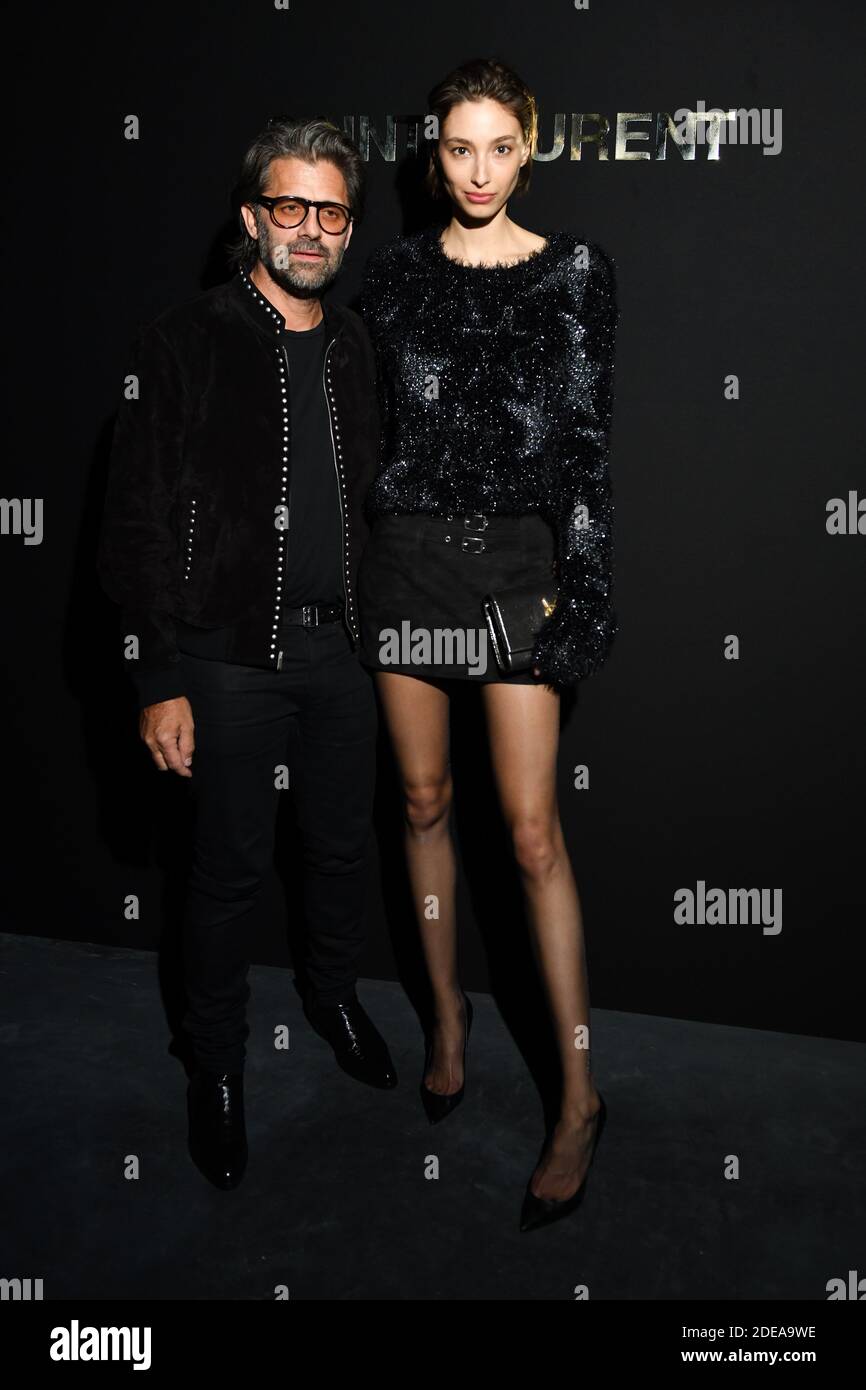 Chris Colis and Alexandra Agoston attend the Saint Laurent show as part