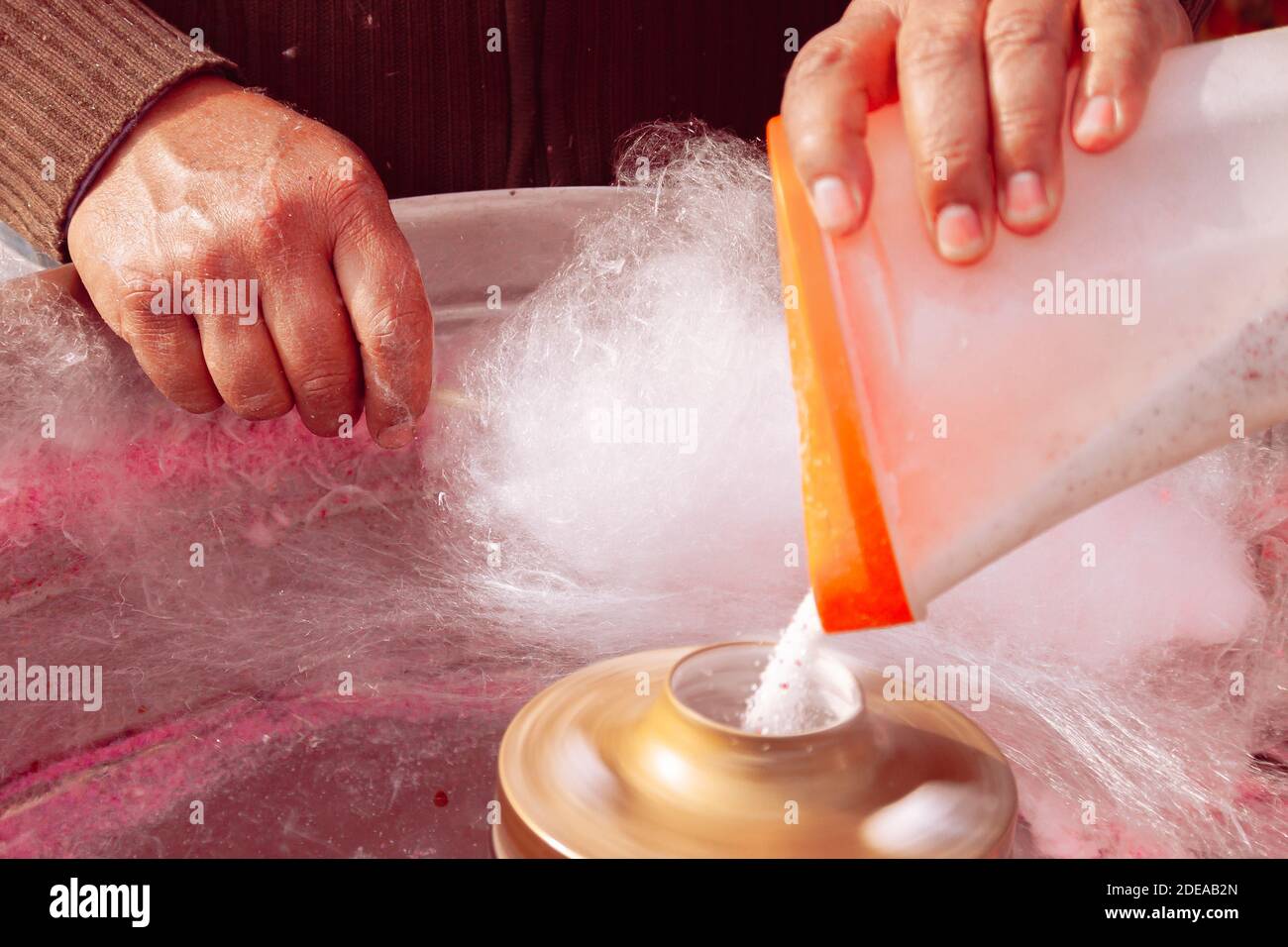 Man making of the Cotton candy with machine. Stock Photo