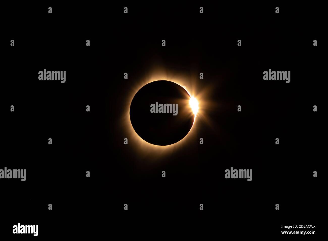 The total solar eclipse on 21 August 2017, as seen from Idaho. About 77 1/2 minutes after first contact. Note the Bailey' Beads.  Yellow filtration fo Stock Photo