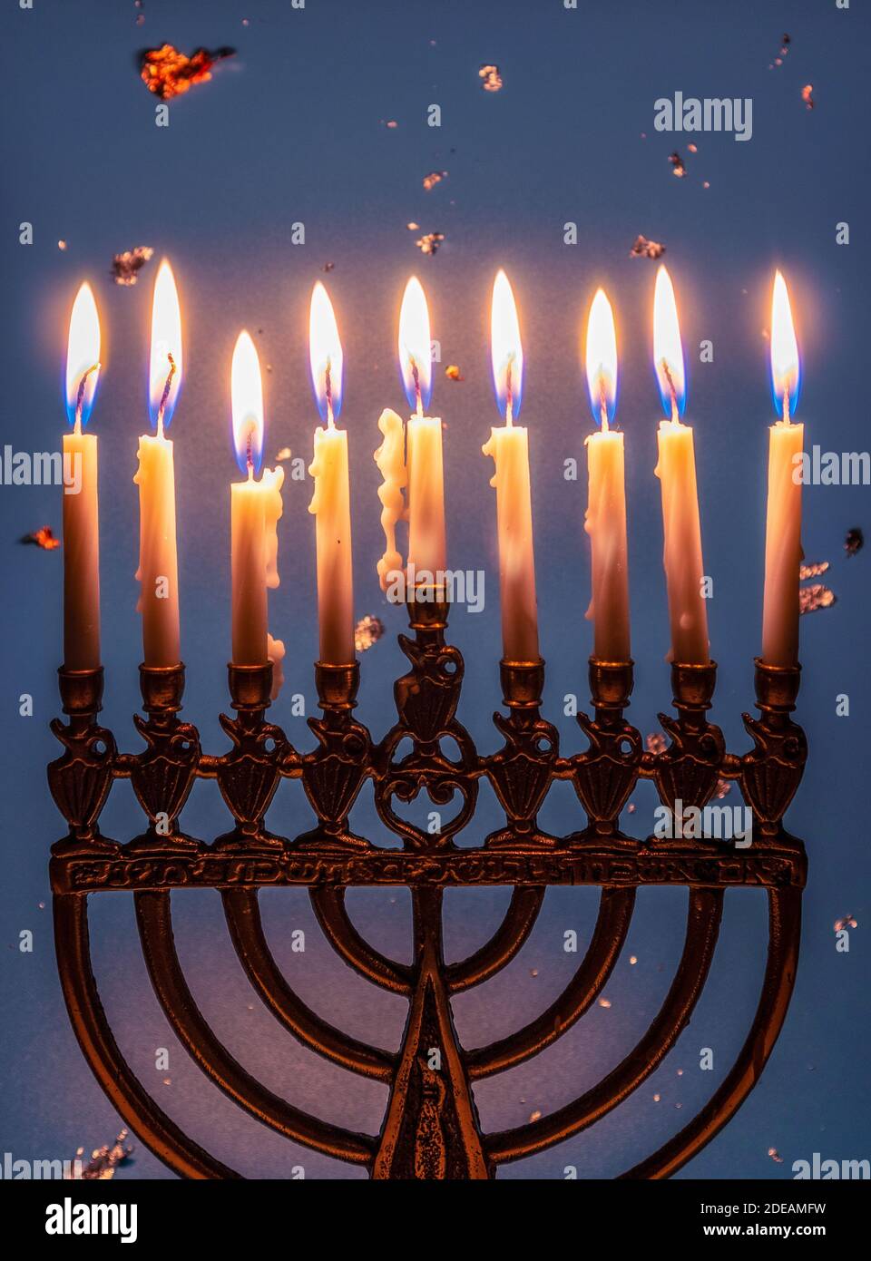 Menorah with nine burning candles. Jewish holiday Hanukkah Stock Photo
