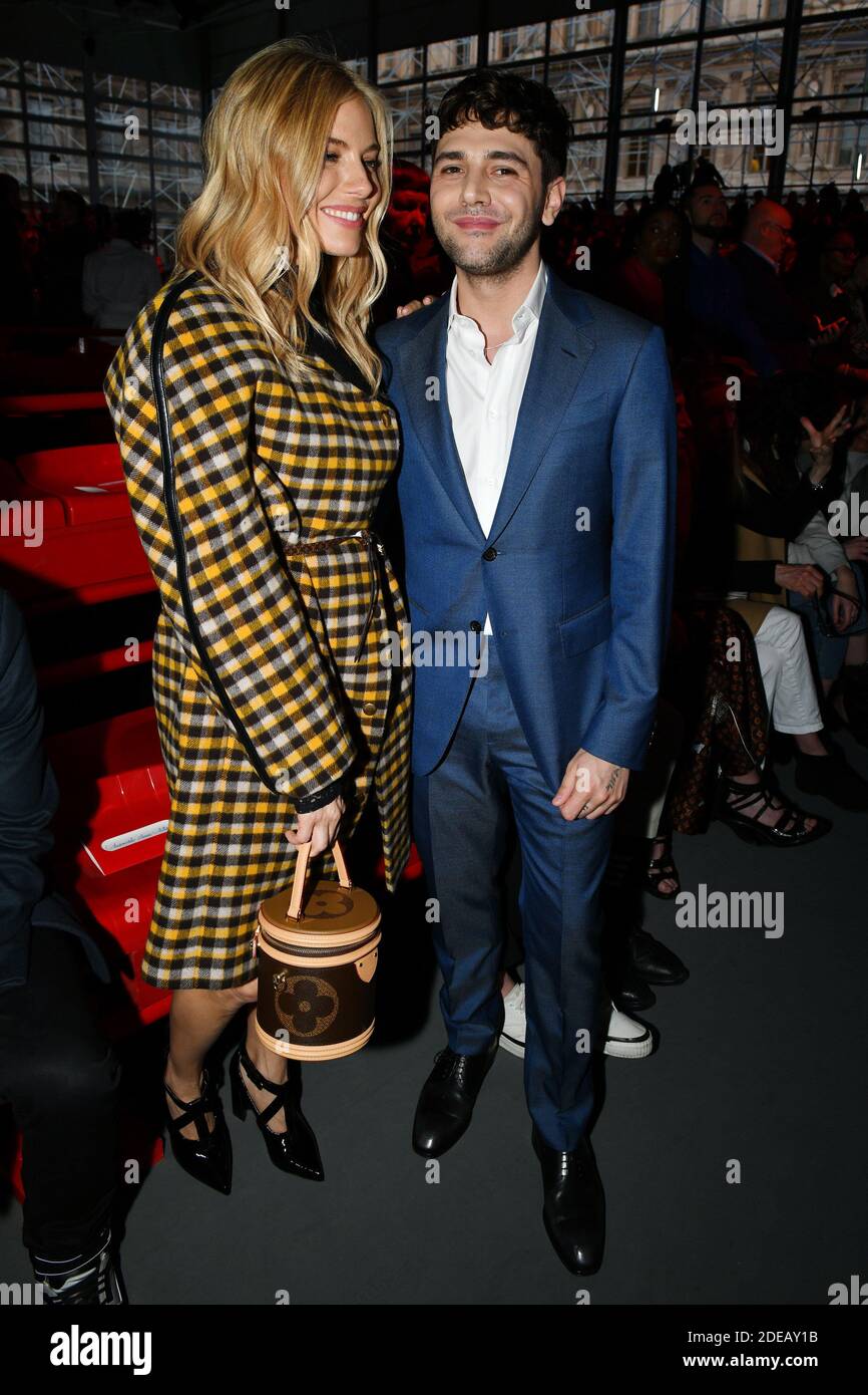 Sienna Miller and Xavier Dolan attend the Louis Vuitton show as part of the  Paris Fashion