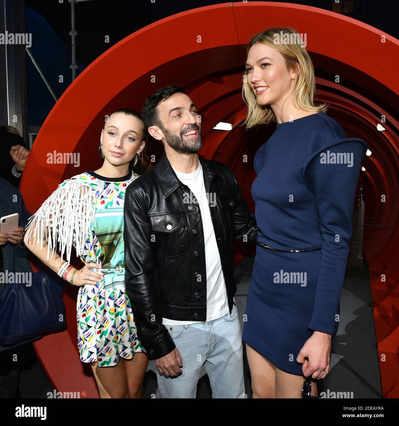 Emma Chamberlain, Stylist Nicolas Ghesquiere and Karlie Kloss pose after  the Louis Vuitton show as part of the Paris Fashion Week Womenswear  Fall/Winter 2019/2020 on March 05, 2019 in Paris, France. Photo