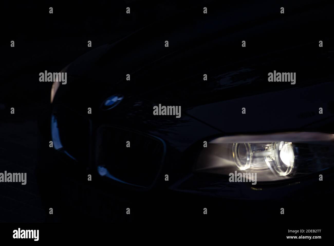 Car light beams in the dark night, moving forward dark themed Stock