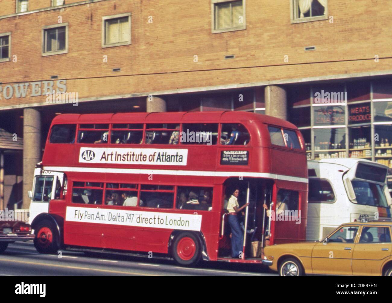 Double decker bus on the streets of Atlanta; ca. 1974 Stock