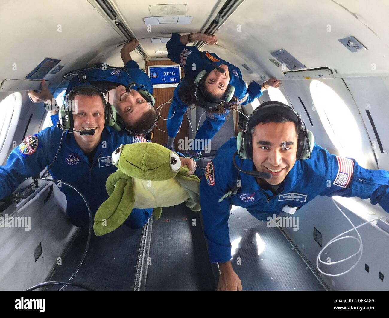 (From left) 2017 NASA astronaut candidates Bob Hines, Matthew Dominick, Jasmin Moghbeli, and Raja Chari take hold to their surroundings during their reduced gravity flight aboard Canadian Space Agency's Dassault Falcon 20 Jet on February 21, 2018. NASA is honoring the first class of astronaut candidates to graduate under the Artemis program on January 10, 2019, at the agency's Johnson Space Center in Houston. After completing more than two years of basic training, these candidates will become eligible for spaceflight, including assignments to the International Space Station, Artemis missions t Stock Photo
