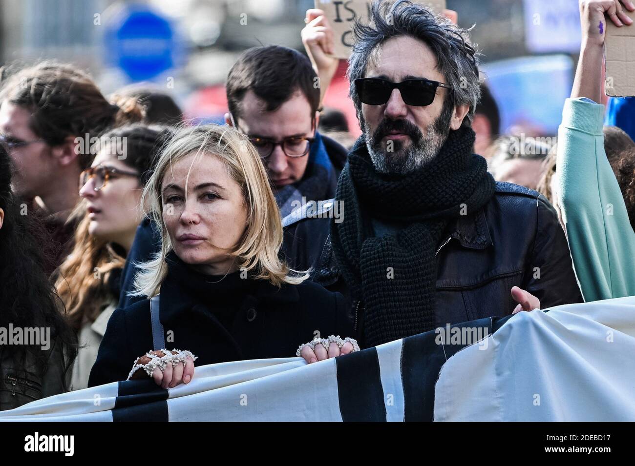 Emmanuelle Beart and her husband Frederic Chaudier take part in the 'March  of The Century' to demand answers to climate change at the Place de l'  Opera in Paris, France, on March