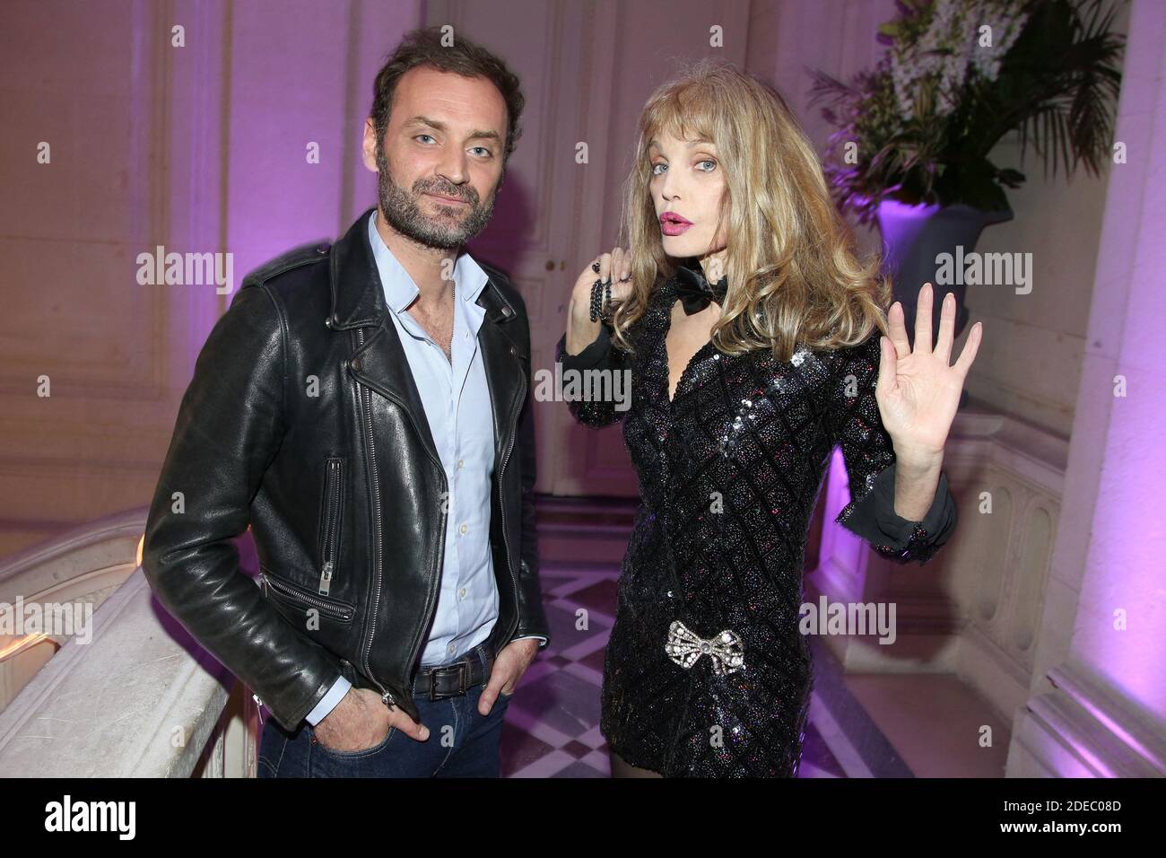 Augustin Trapenard et Arielle Dombasle lors de la soirée de lancement du  nouveau parfum d'Azzaro WANTED GIRL a l'Hotel Salomon de Rothschild, a  Paris, France, le 29 Mars 2019. Photo by Jerome