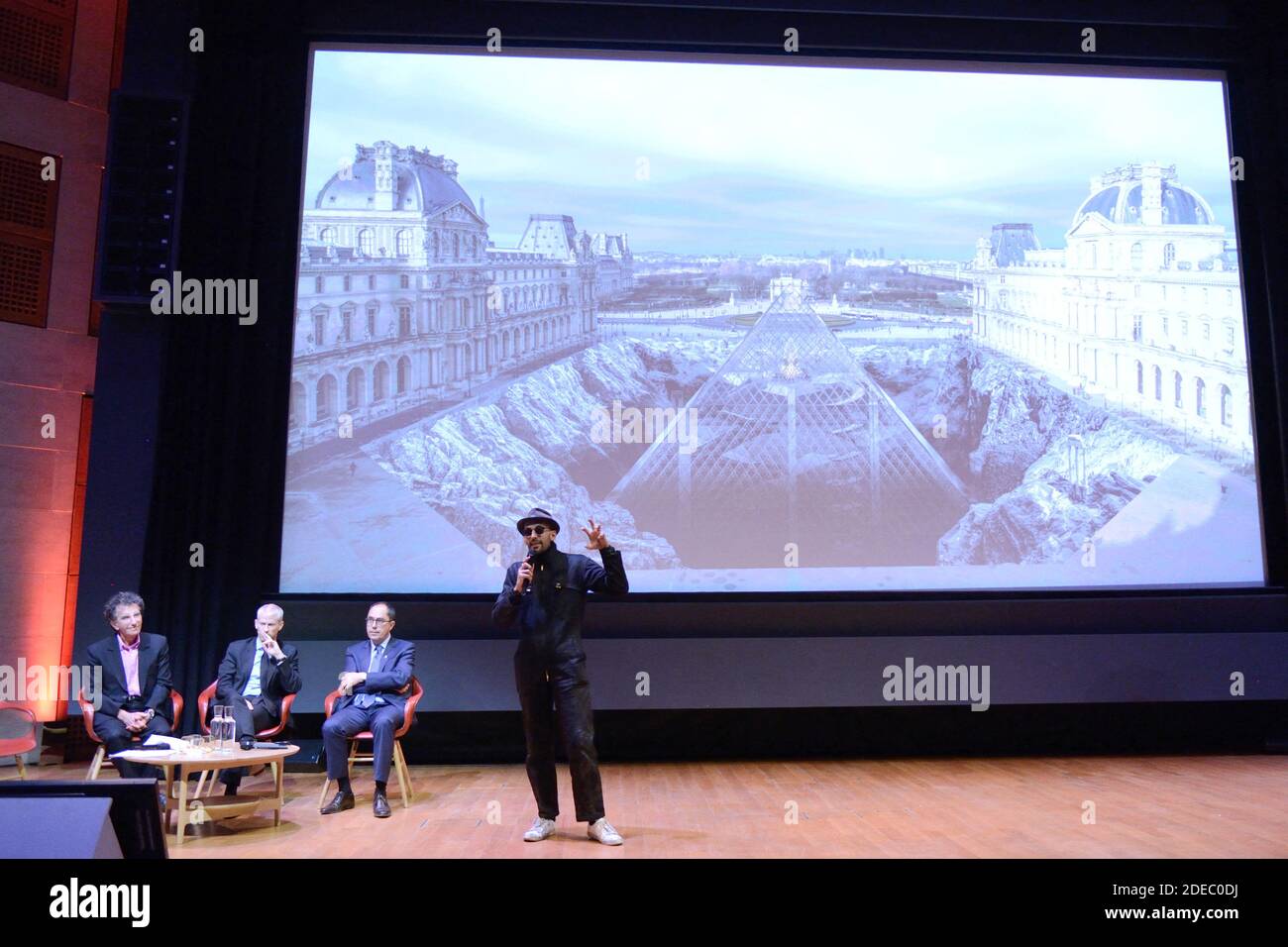 JR attending the 'JR au Louvre & Le Secret de la Grande Pyramide' : Photographer and artist Jean Rene, aka JR, creates a monumental Piece of Art on the scale of Napoleon Court of the Louvre Museum on March 29, 2019 in Paris, France. As part of the celebrations of the 30th anniversary of the Louvre Pyramid, the street artist JR proposes a giant collage to bring out the Pyramid of the Louvre by revealing the foundations of the Napoleon courtyard where it is erected. Photo by Aurore Marechal/ABACAPRESS.COM Stock Photo