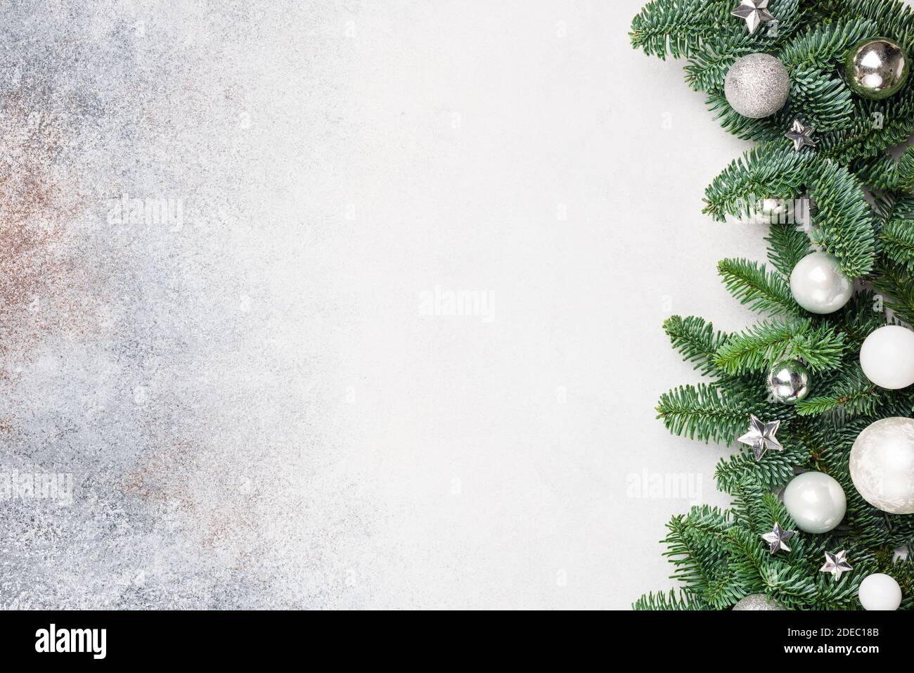 Christmas background with fir tree and silver white toys, copy space for text design greeting Stock Photo