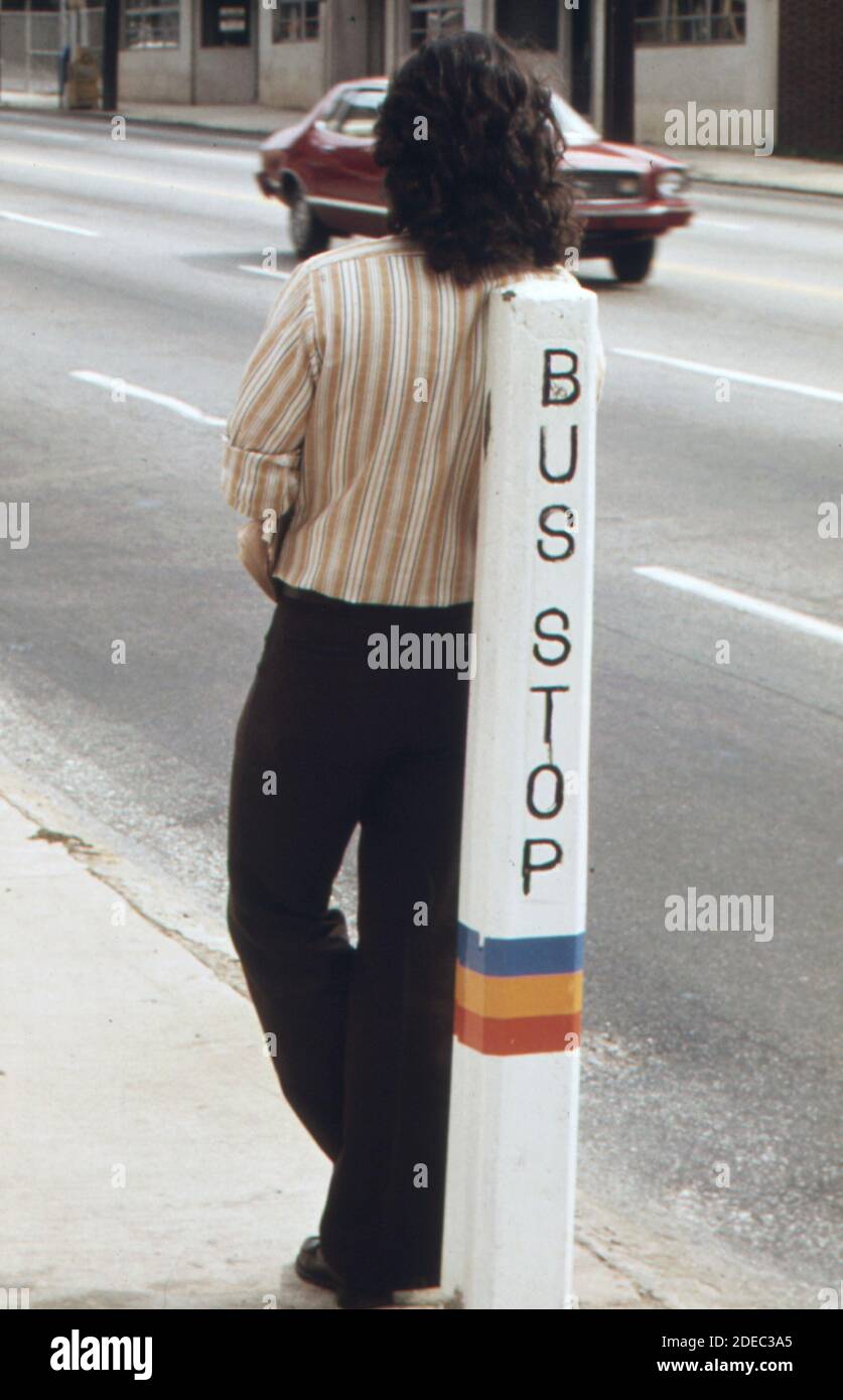 Bus stop is a leaning post for a passenger waiting for a Metropolitan Atlanta Rapid Transit Authority (MARTA) bus in Atlanta; Georgia.  ca. 1974 Stock Photo