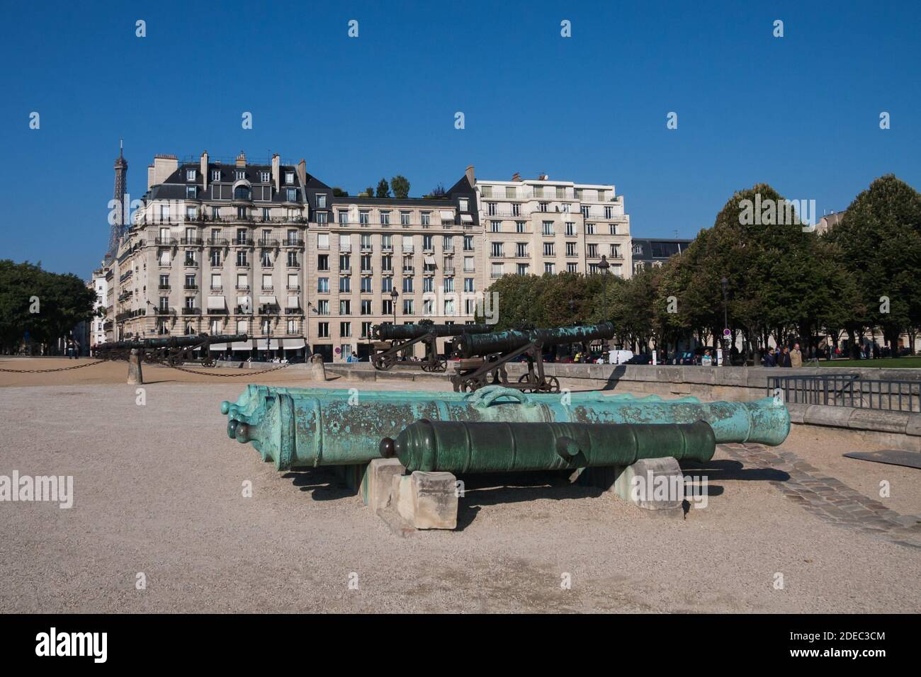 Paris, France Sept 27 2015: Outside of Hotel les Invalides (Invalids Residence) with view of cannons and Eiffel Tower. People are out enjoying Stock Photo