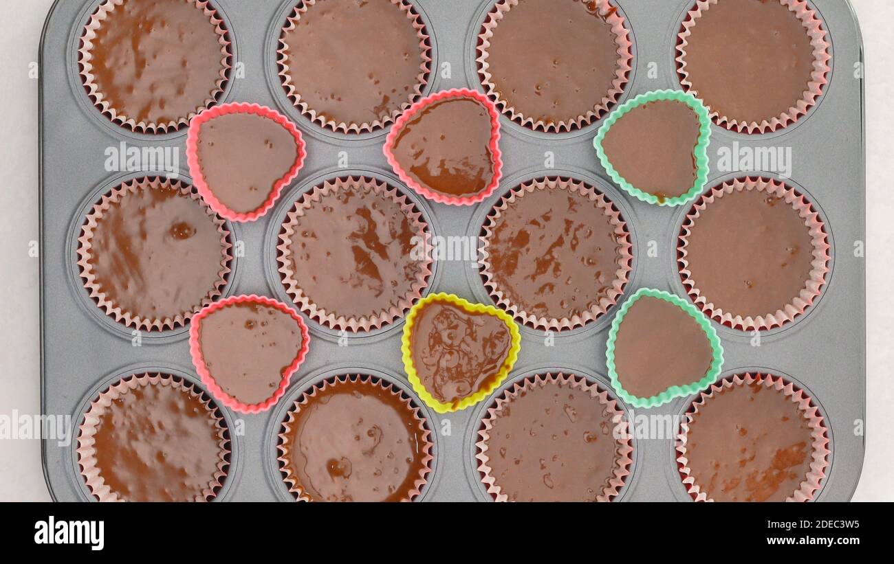 Chocolate cupcakes recipe. Cupcake pan lined with paper liners, and silicon molds filled with