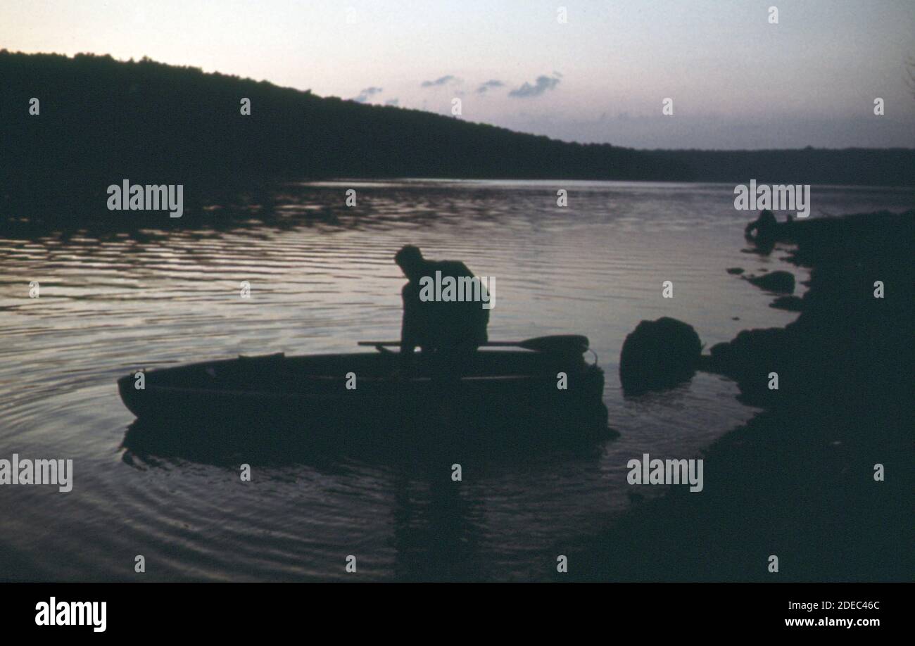 1970s Photos (1973) - Fisherman launches his boat into the Grand Glaize