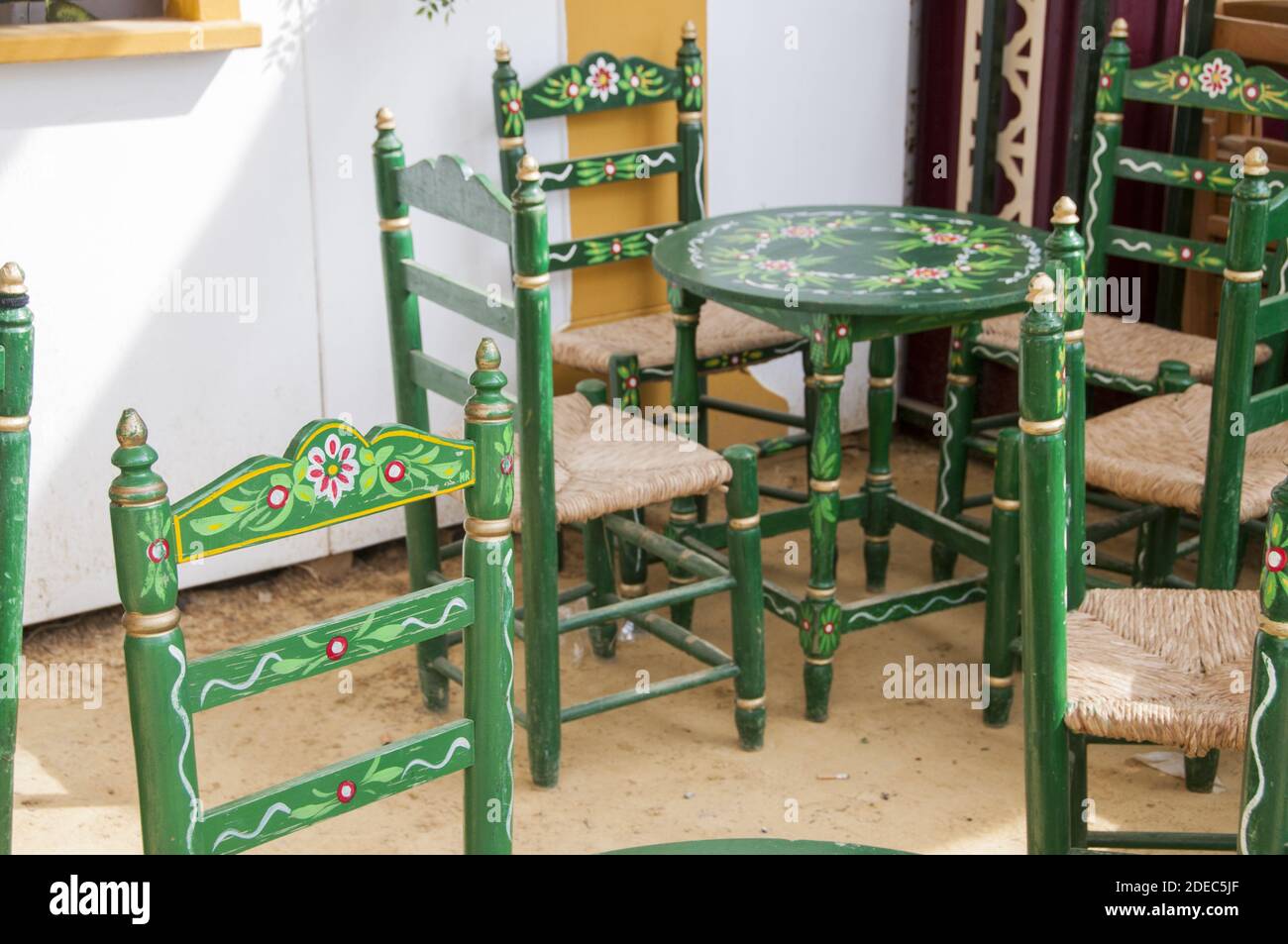 A closeup of rustic painted wooden table and chairs in traditional Mexican style Stock Photo Alamy