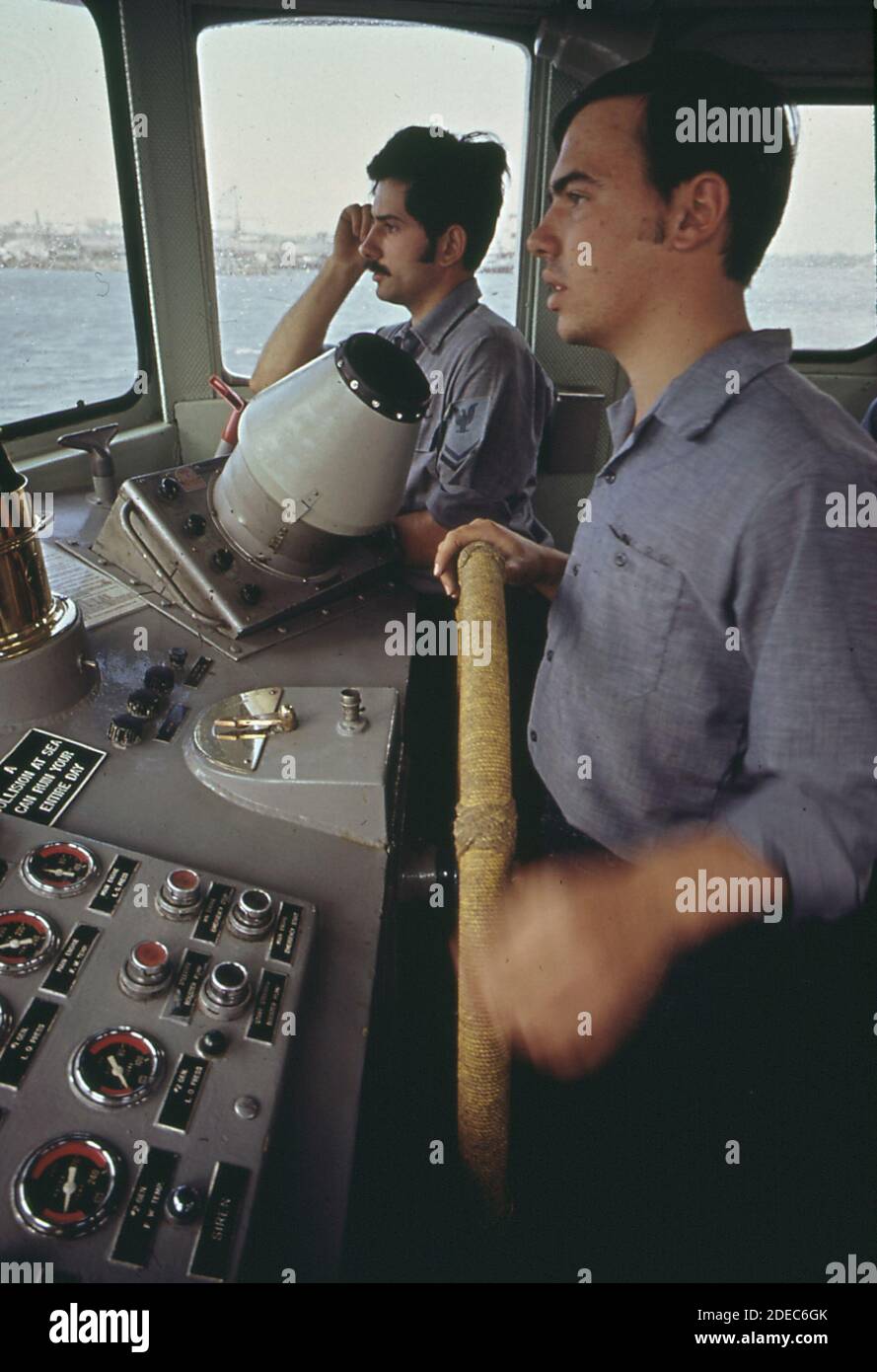 Crew aboard a Coast Guard vessel on daily inspection of harbor ships
