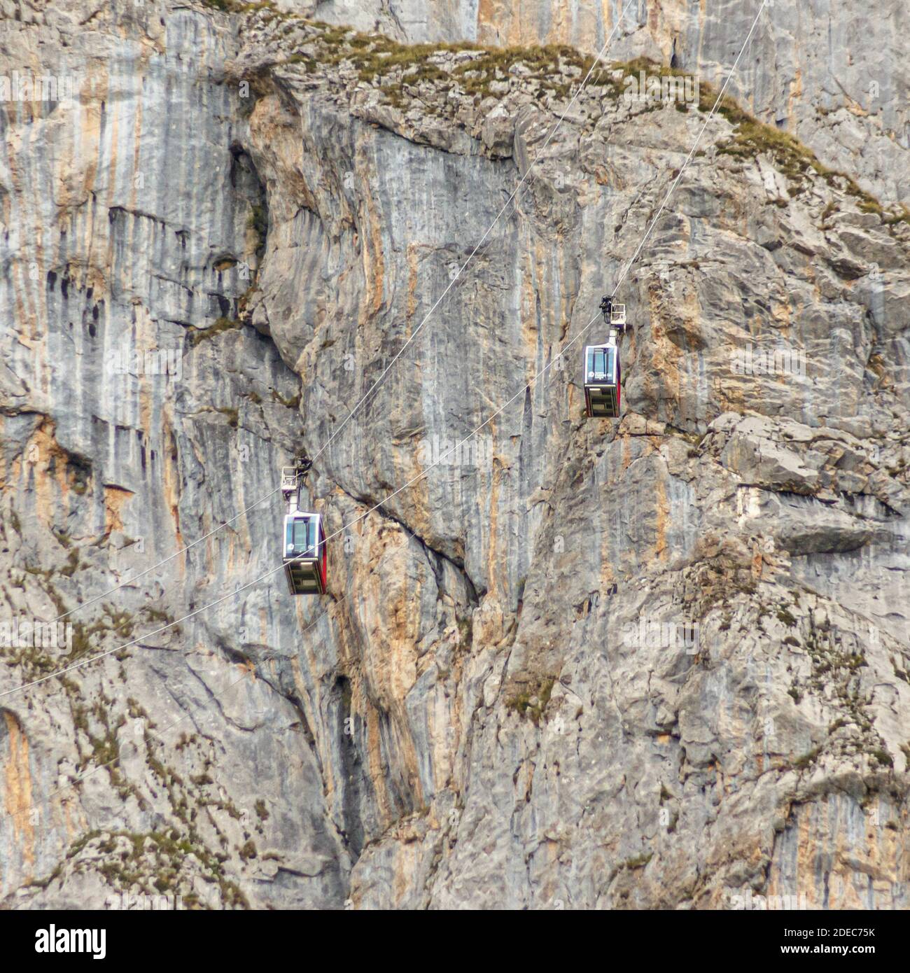 A mountain rock with aerial ropeway wagons Stock Photo - Alamy