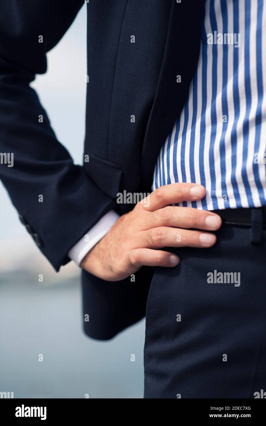 Close up of a business man hand on hip Stock Photo