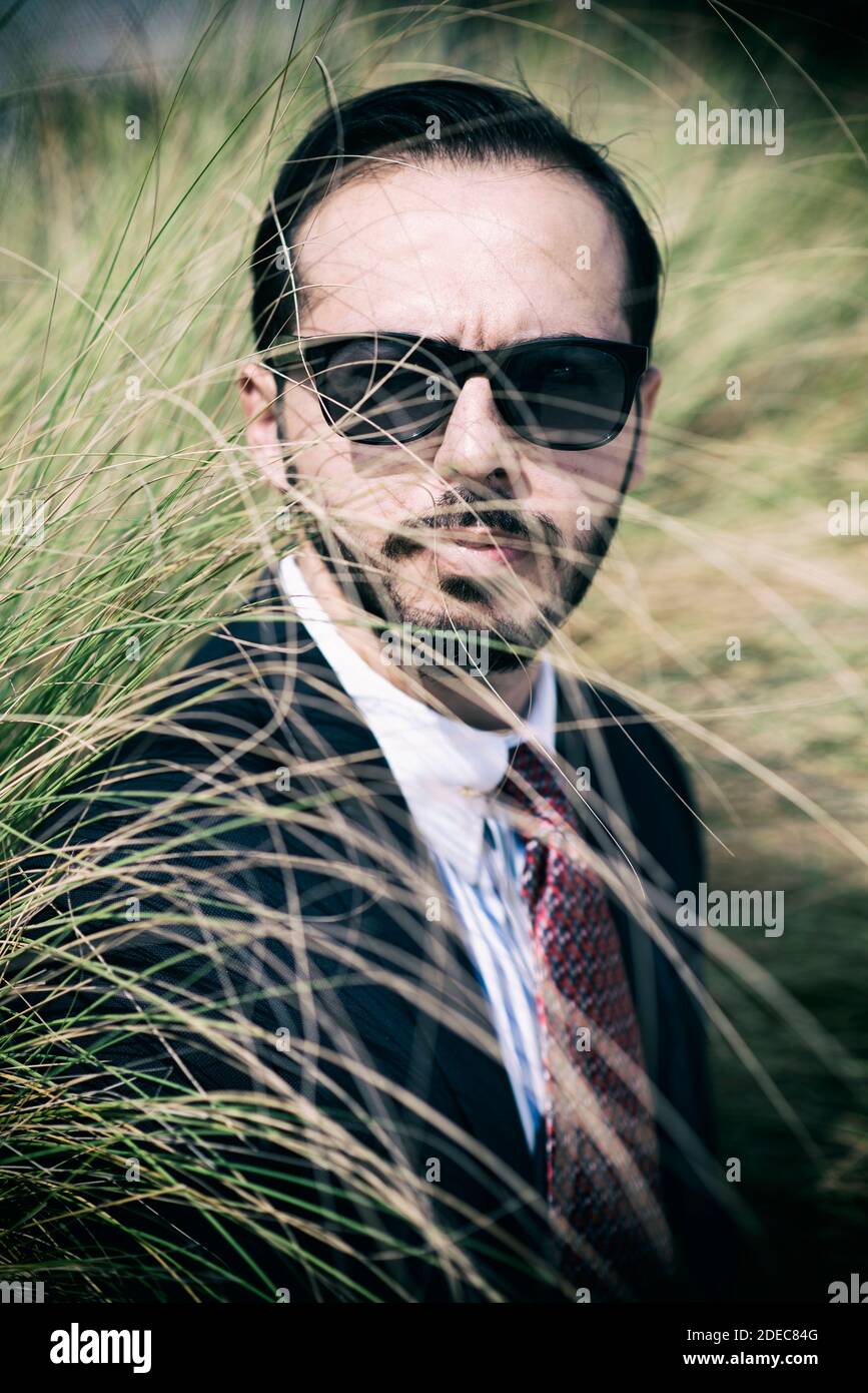 Man in suit wearing sunglasses Stock Photo