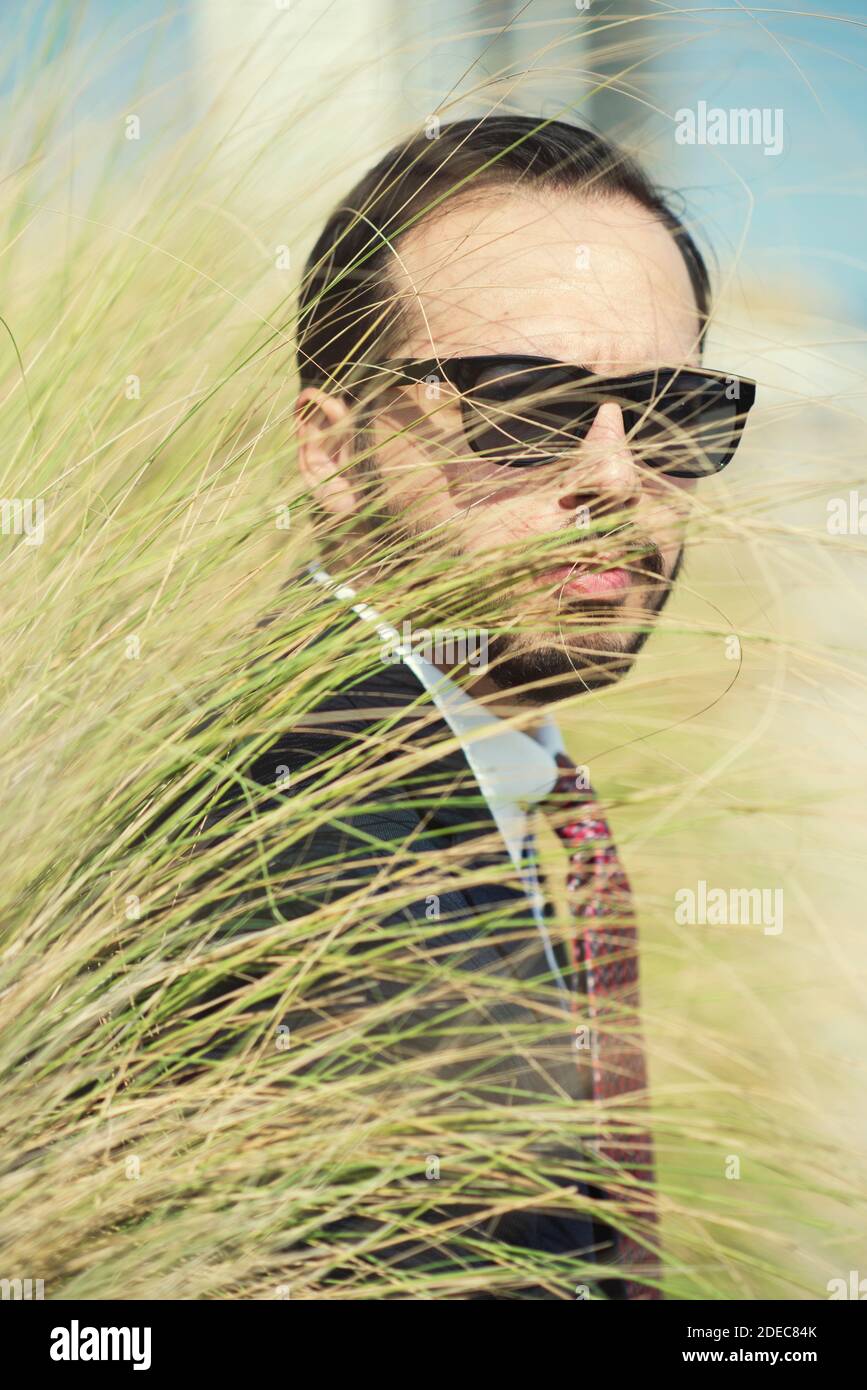 Man in suit wearing sunglasses Stock Photo