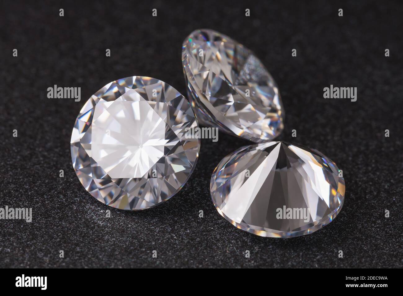 Three precious stones on a dark background, close-up Stock Photo