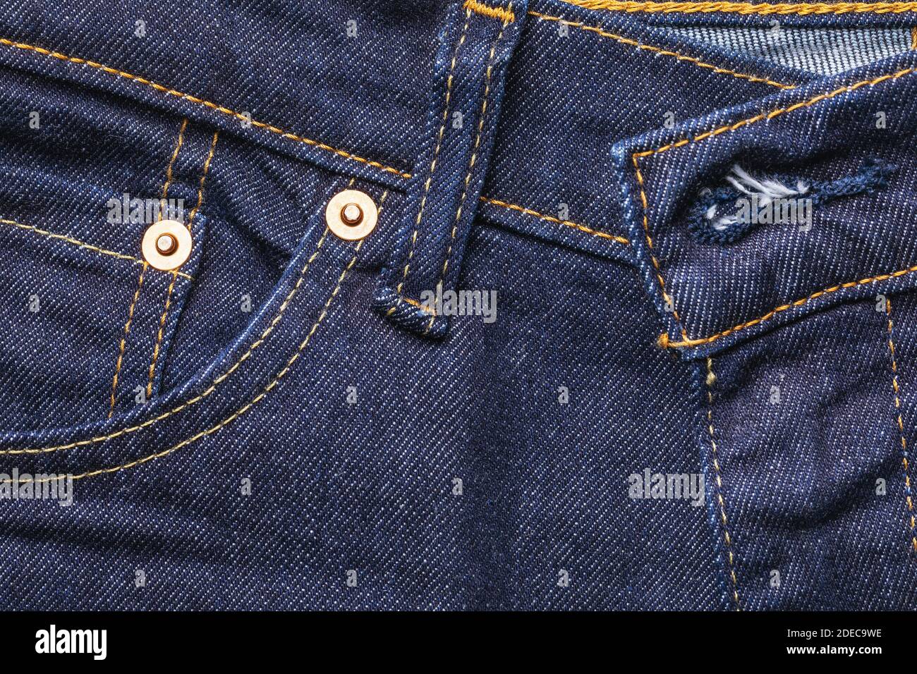 Dark blue jeans texture for use as a background. Stock Photo