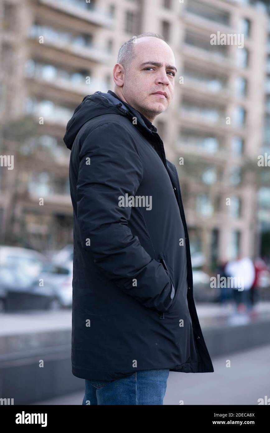 Pensive 45 years old man looking away outdoors Stock Photo