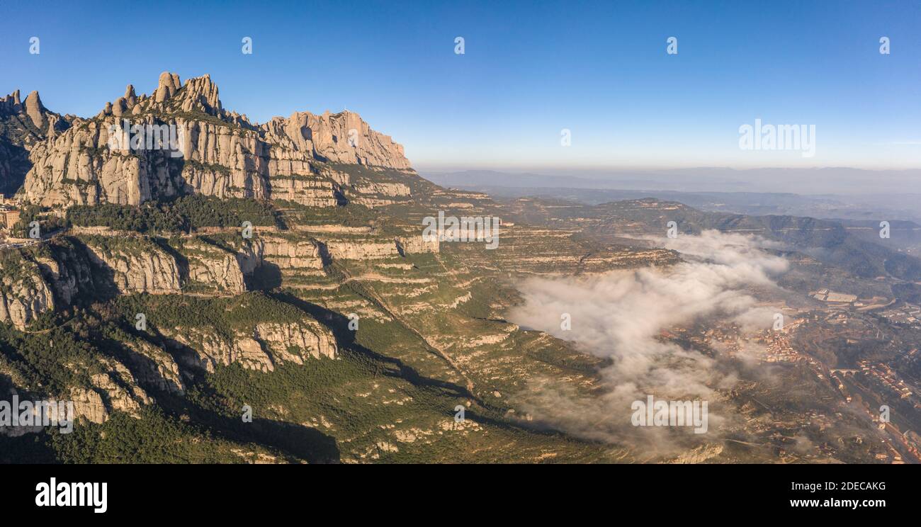 Panoramic aerial drone view of Montserrat mountain range and its valley near Barcelona Stock Photo